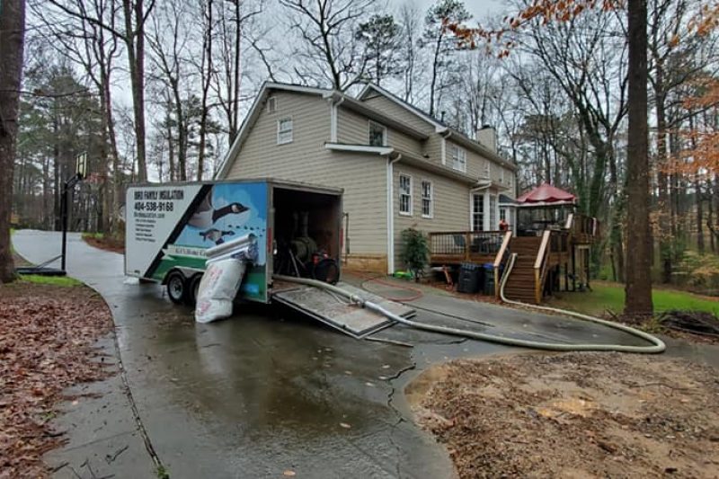 Bird Family Insulation truck at a home