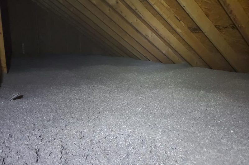 A layer of cellulose insulation in an attic